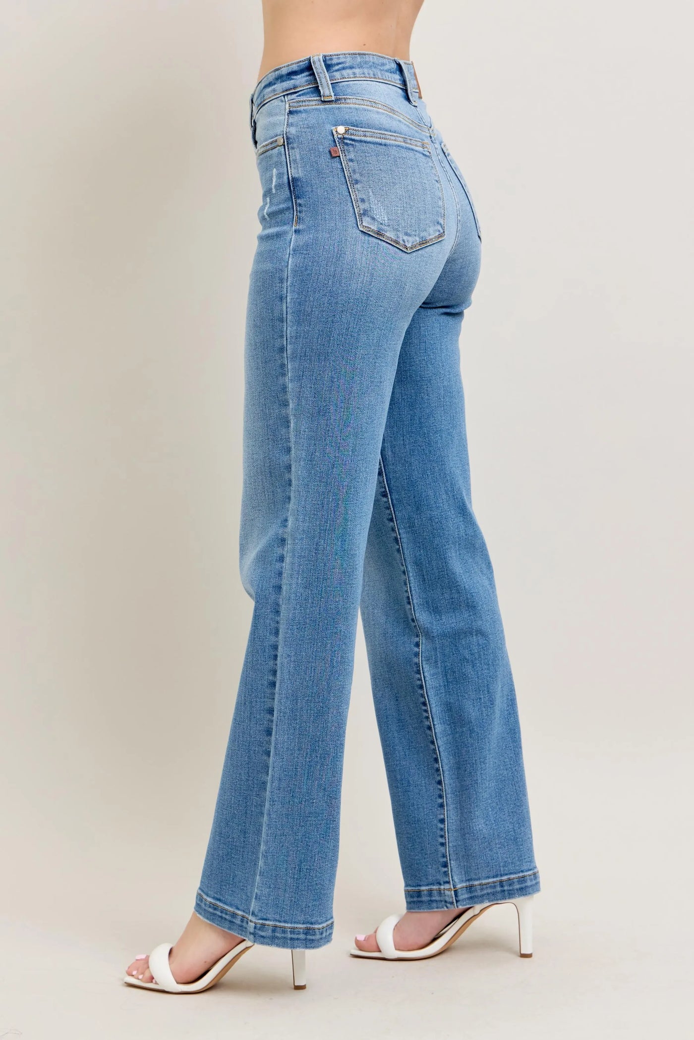 Plus-size model showcasing the flattering fit of Judy Blue Full Size High-Waist Straight Jeans, designed for all-day comfort