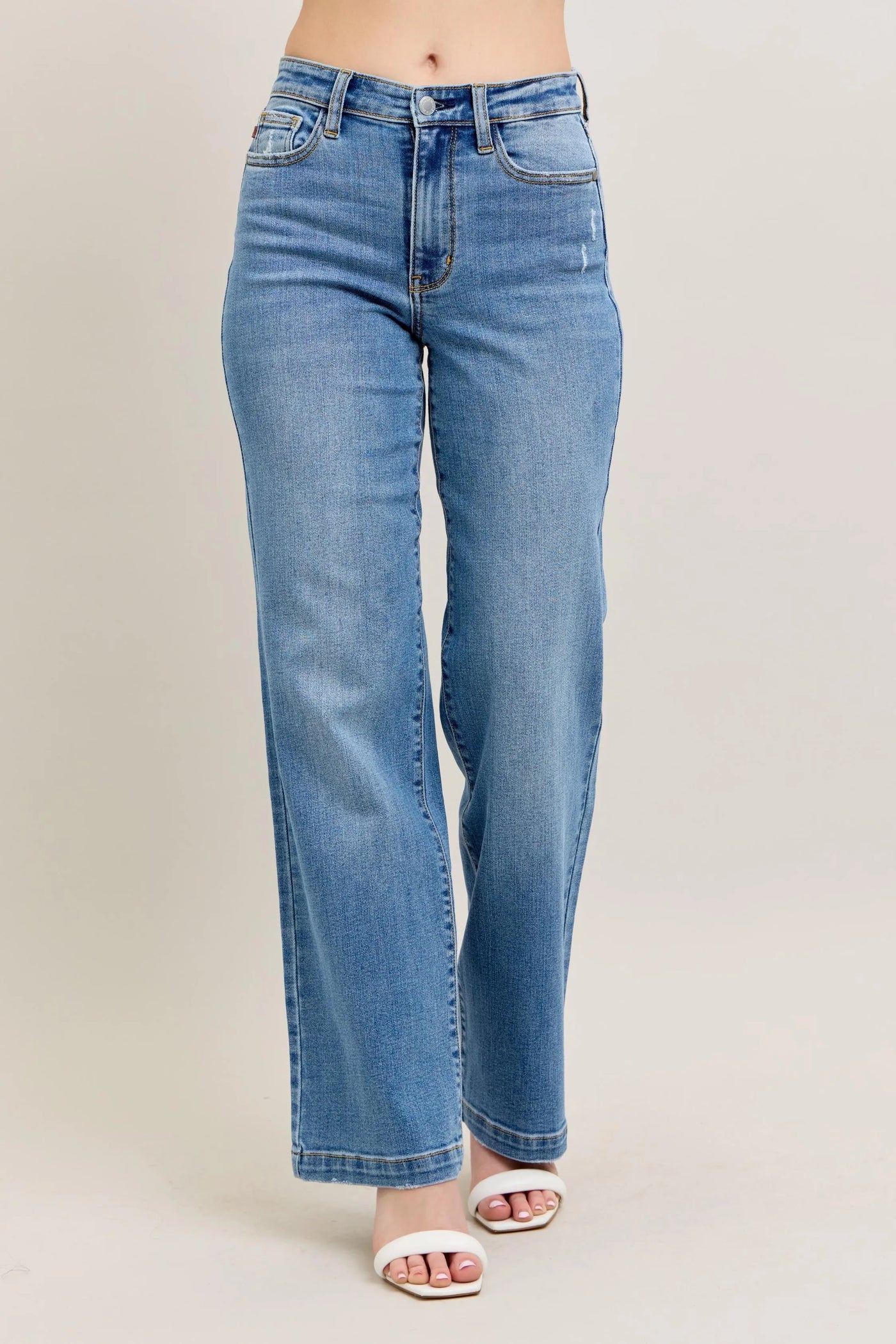 Side view of Judy Blue Full Size High-Waist Straight Jeans, showing the structured fit and high-waisted design for a flattering look.