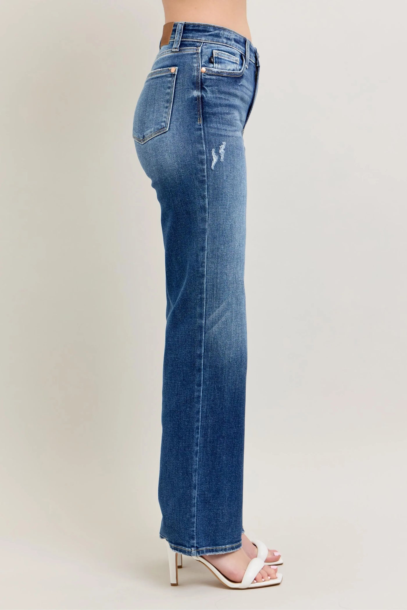 Plus-size model showing off the perfect fit of Judy Blue Full Size High-Waist 90s Straight Leg Jeans, designed for comfort and style.