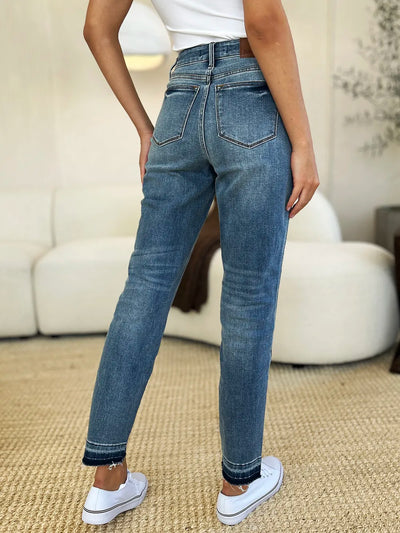 Side view showcasing the fit of Judy Blue Full Size Mid Rise Rigid Magic Release Hem Jeans.