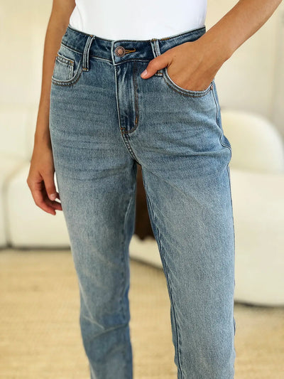 Another side view highlighting the design of Judy Blue Full Size Mid Rise Rigid Magic Release Hem Jeans.