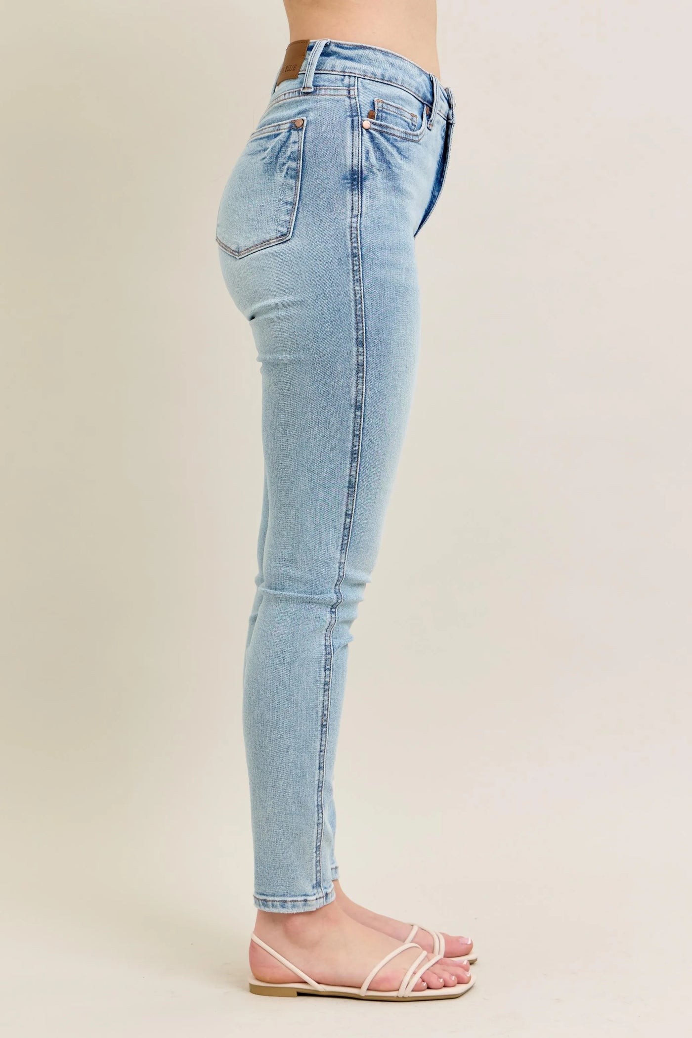 Back view highlighting the design of Judy Blue Full Size Mid Rise Tummy Control Vintage Wash Skinny Jeans Plus Size.