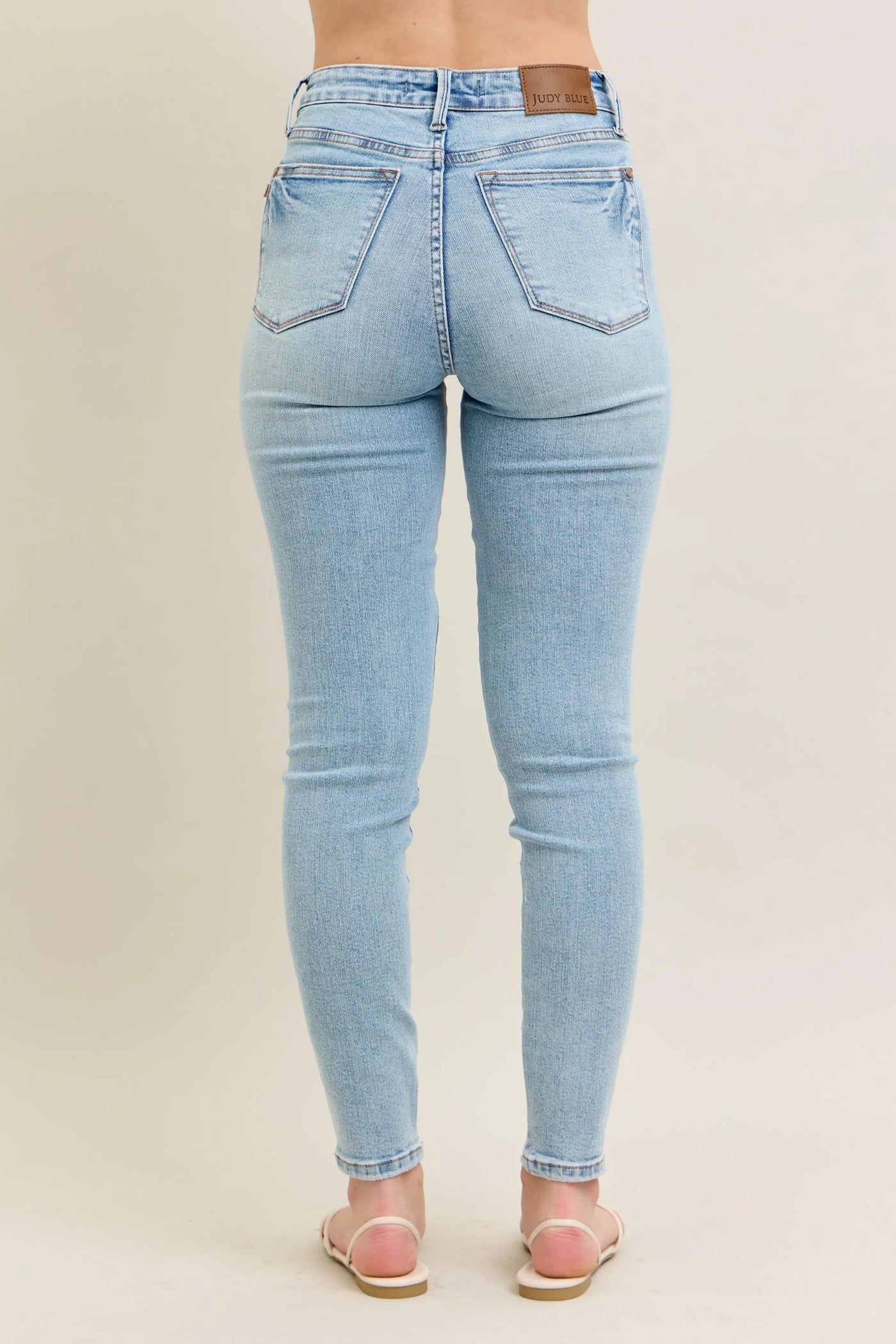 Close-up of the back detailing of Judy Blue Full Size Mid Rise Tummy Control Vintage Wash Skinny Jeans Plus Size.