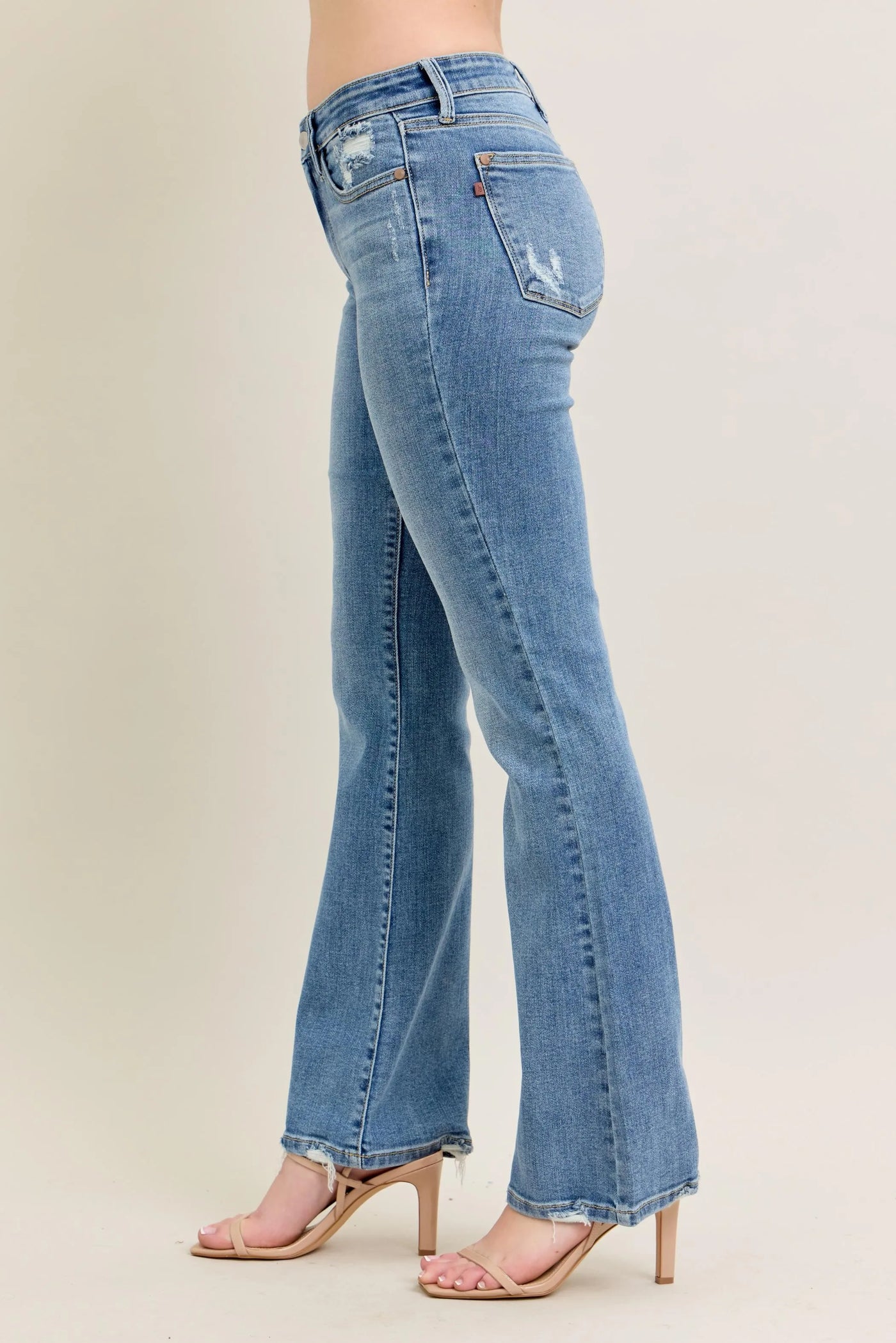 Back view highlighting the design of Judy Blue Full Size Mid Rise Wash Destroy Hem Bootcut Jeans Plus Size.