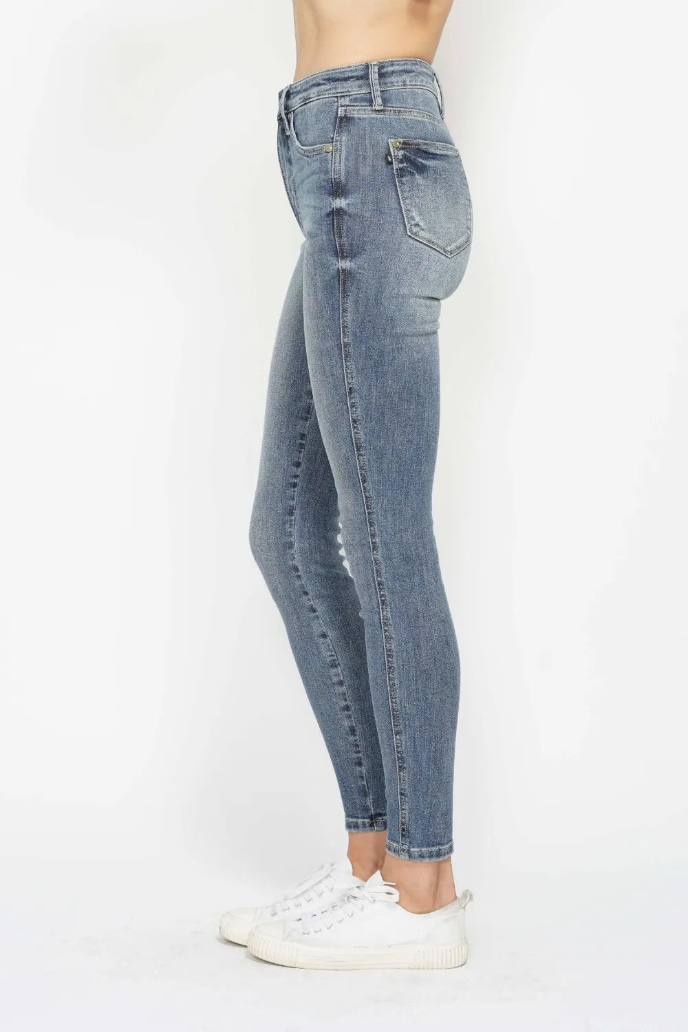 Close-up of the back detailing of Judy Blue Full Size Tummy Control Contrast Wash Skinny Jeans.