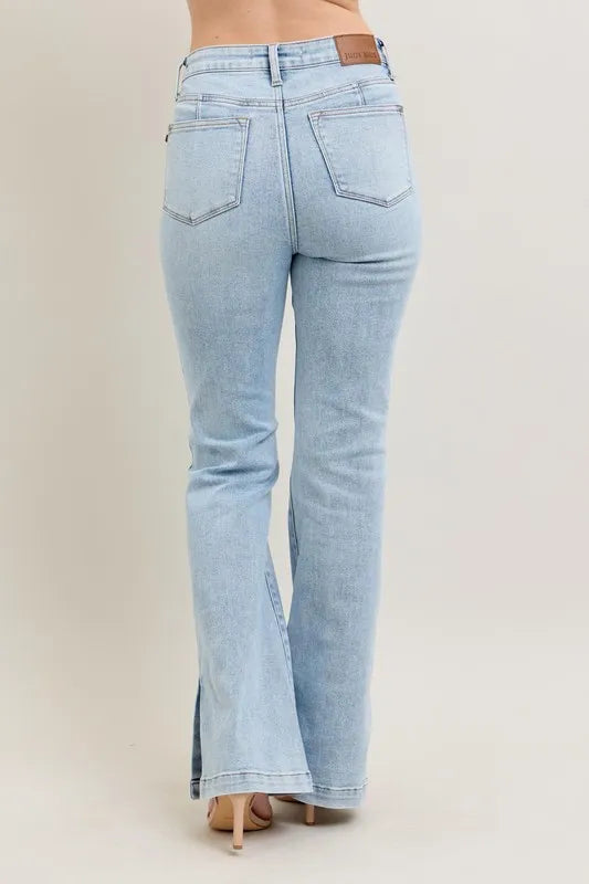 Close-up side view emphasizing the side slit and bootcut flare of Judy Blue Full Size Tummy Control Vintage Wash Side Slit Slim Boot Jeans Plus Size.