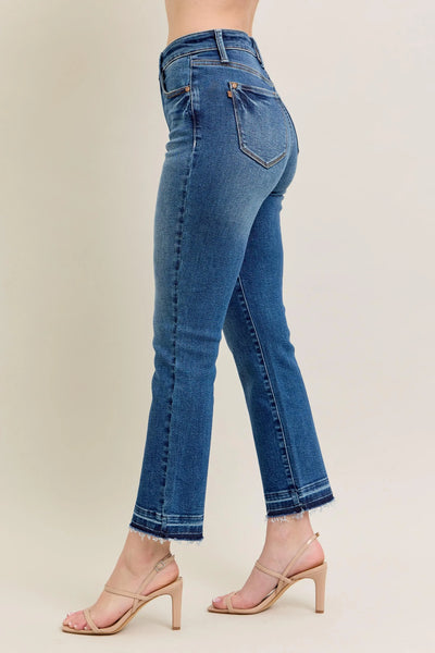 Angled front view of Judy Blue Full Size High-Waisted Vintage Wash Release Hem Kick Flare Jeans Plus Size, showcasing the silhouette.