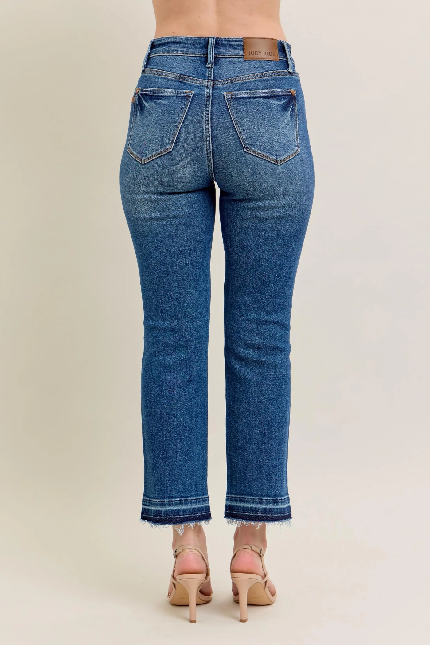 Close-up of the back detailing of Judy Blue Full Size High-Waisted Vintage Wash Release Hem Kick Flare Jeans Plus Size.