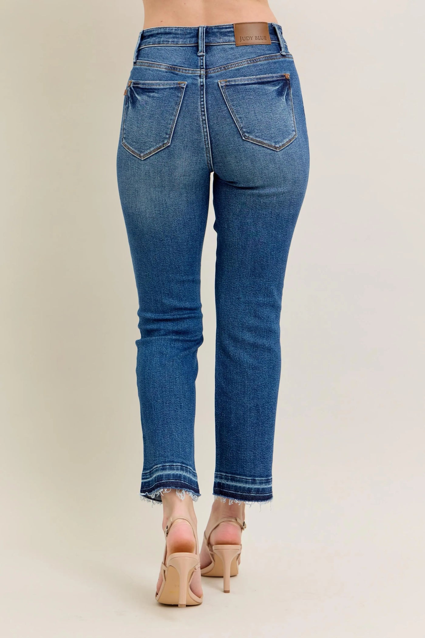 Close-up side view emphasizing the flare of Judy Blue Full Size High-Waisted Vintage Wash Release Hem Kick Flare Jeans Plus Size.