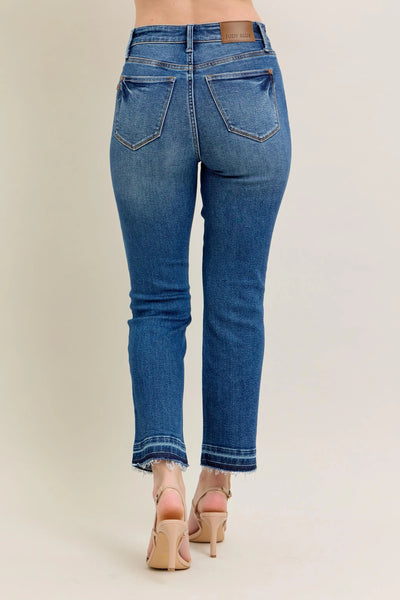 Close-up side view emphasizing the flare of Judy Blue Full Size High-Waisted Vintage Wash Release Hem Kick Flare Jeans Plus Size.