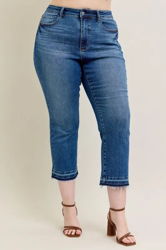 Back view of model wearing Judy Blue Full Size High-Waisted Vintage Wash Release Hem Kick Flare Jeans Plus Size.