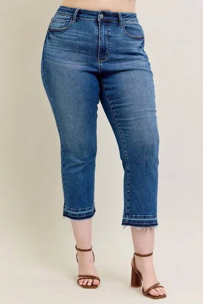 Back view of model wearing Judy Blue Full Size High-Waisted Vintage Wash Release Hem Kick Flare Jeans Plus Size.