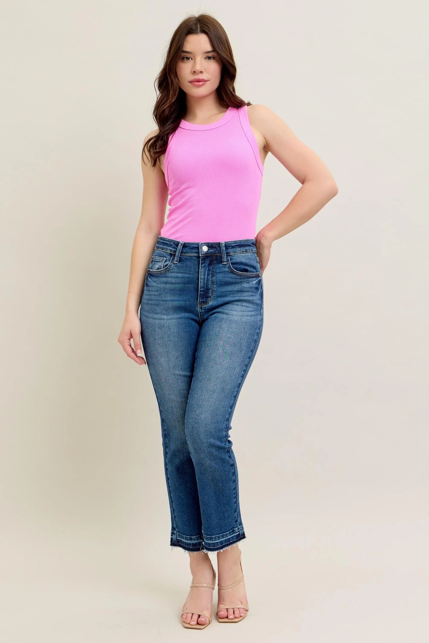 Model wearing Judy Blue Full Size High-Waisted Vintage Wash Release Hem Kick Flare Jeans Plus Size from the front.