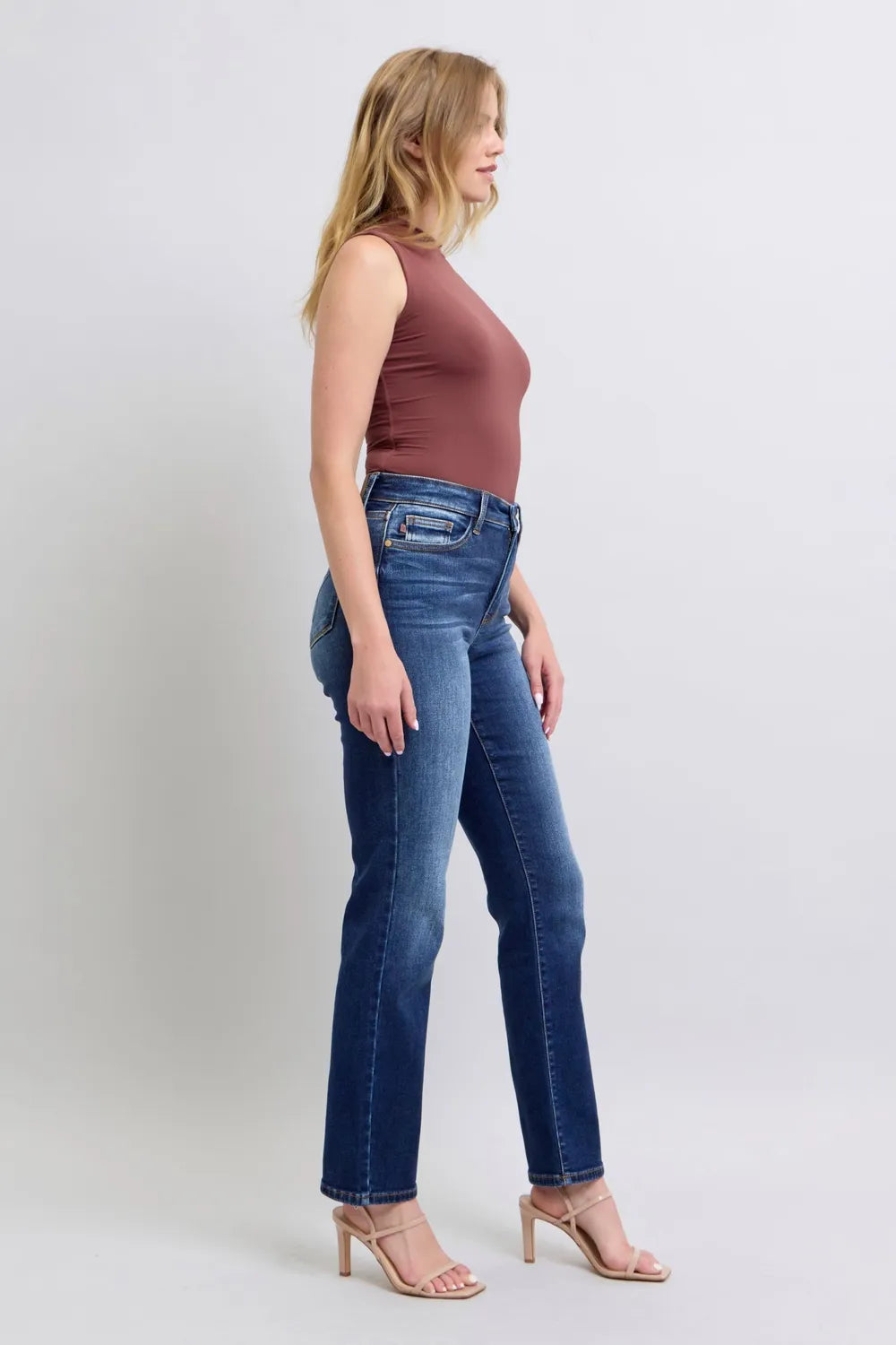 Angled front view of Judy Blue Full Size Washed Straight Leg Jeans with Pockets, showcasing the silhouette.