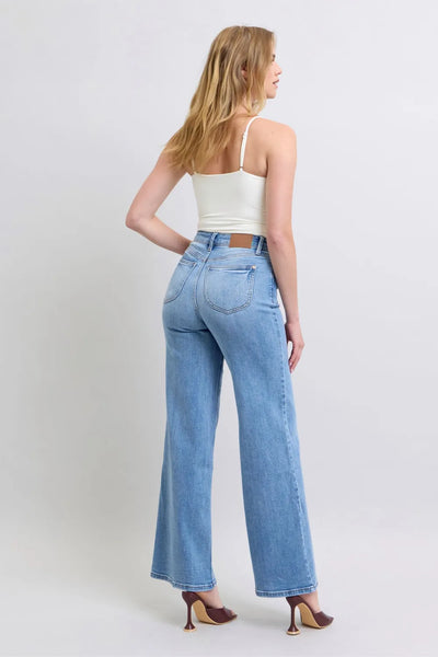 Angled back view of Judy Blue Full Size Wide Leg Jeans with Pockets, highlighting the fit.