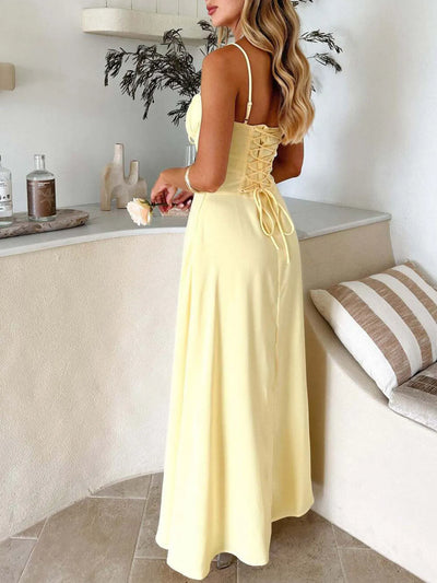 Back view highlighting the Lace-Up Solid Cami Dress in Light Yellow.