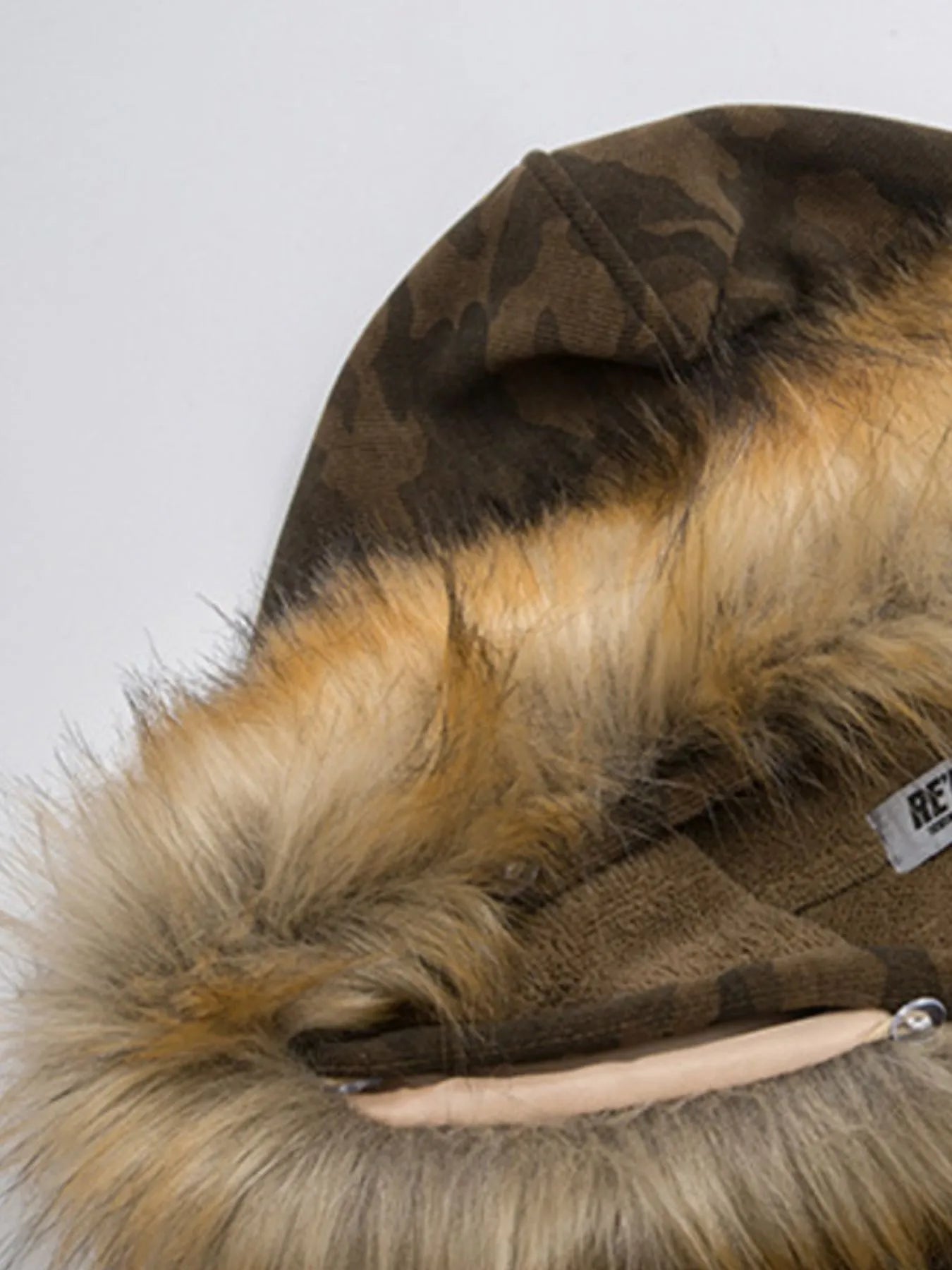 Model wearing Men's Camouflage Faux Fur Hood Jacket in Coffee Brown from the back.