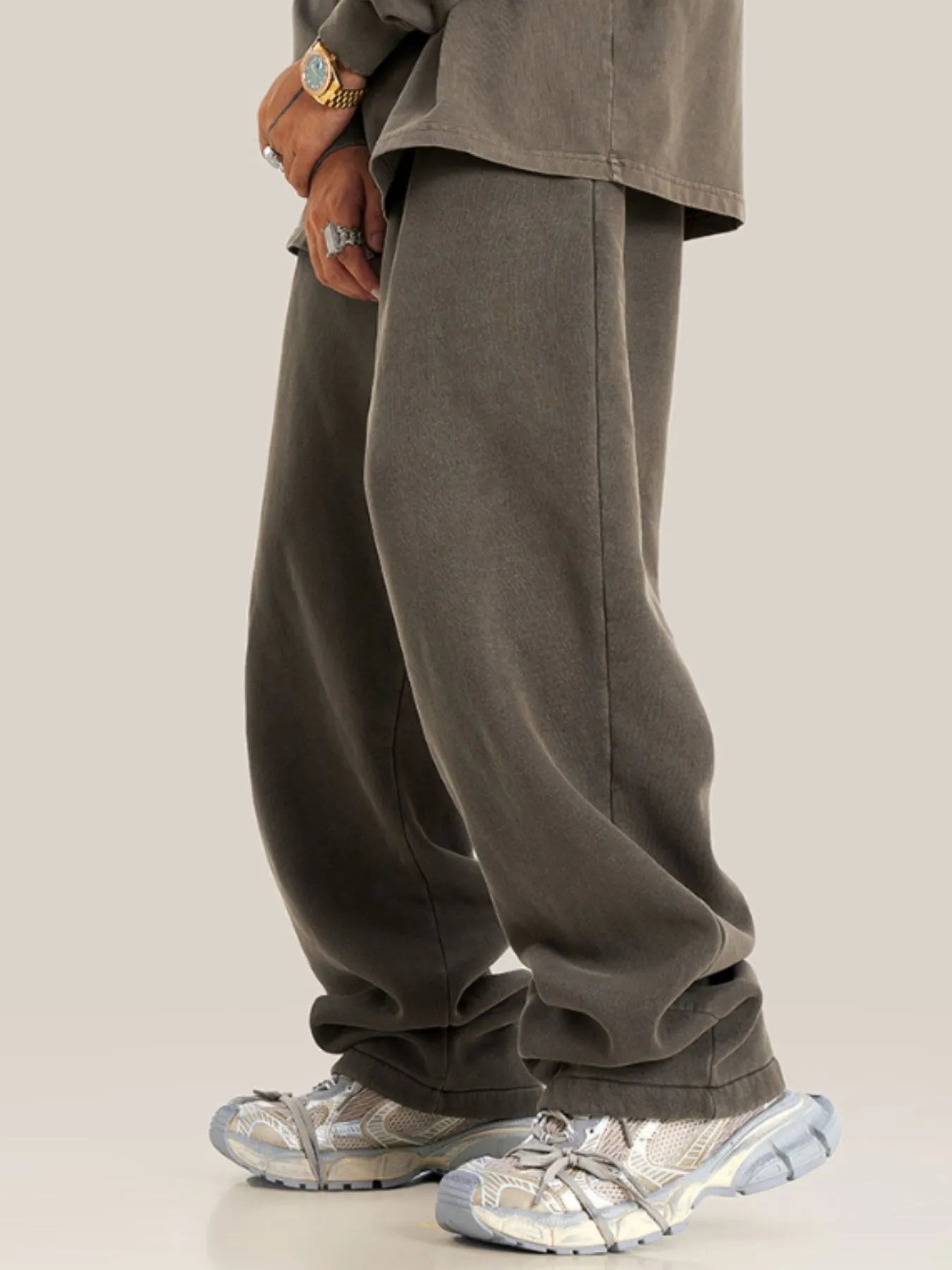 Side view showcasing the fit of Men's Drawstring Wide Leg Pants in Black.