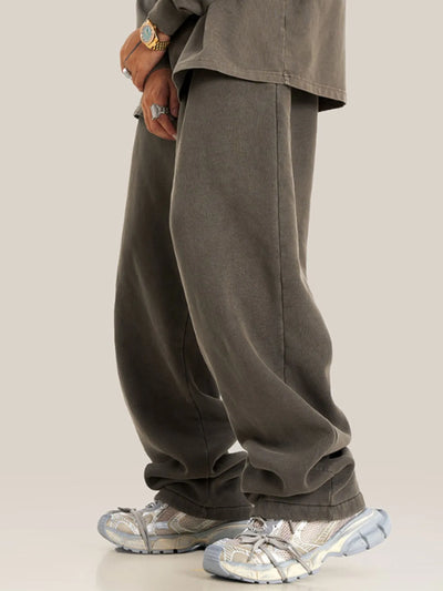 Side view showcasing the fit of Men's Drawstring Wide Leg Pants in Black.