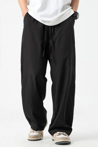 Front view of Men's Drawstring Wide Leg Pants in Black.