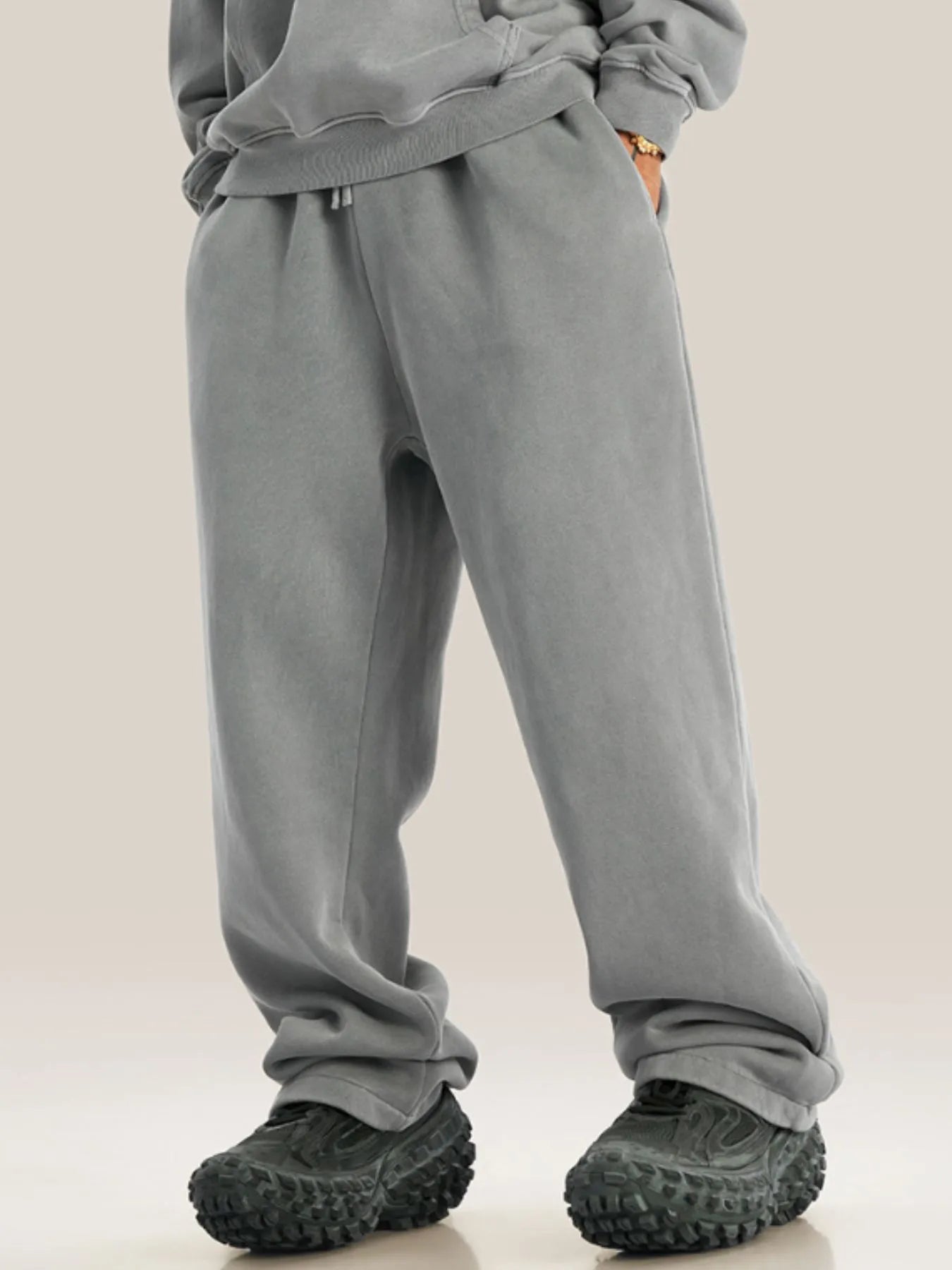 Side view showcasing the fit of Men's Drawstring Wide Leg Pants in Coffee.