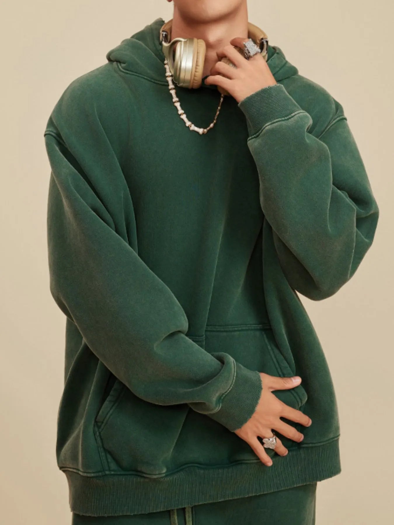 Front view of Men's Kangaroo Pocket Dropped Shoulder Hoodie in D.green.