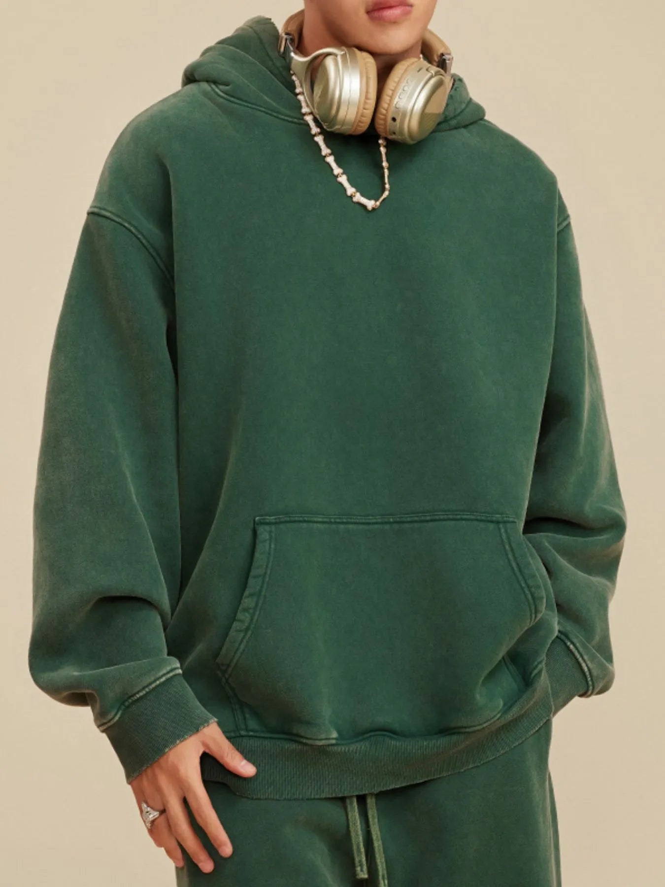 Side view showcasing the fit of Men's Kangaroo Pocket Dropped Shoulder Hoodie in D.green.