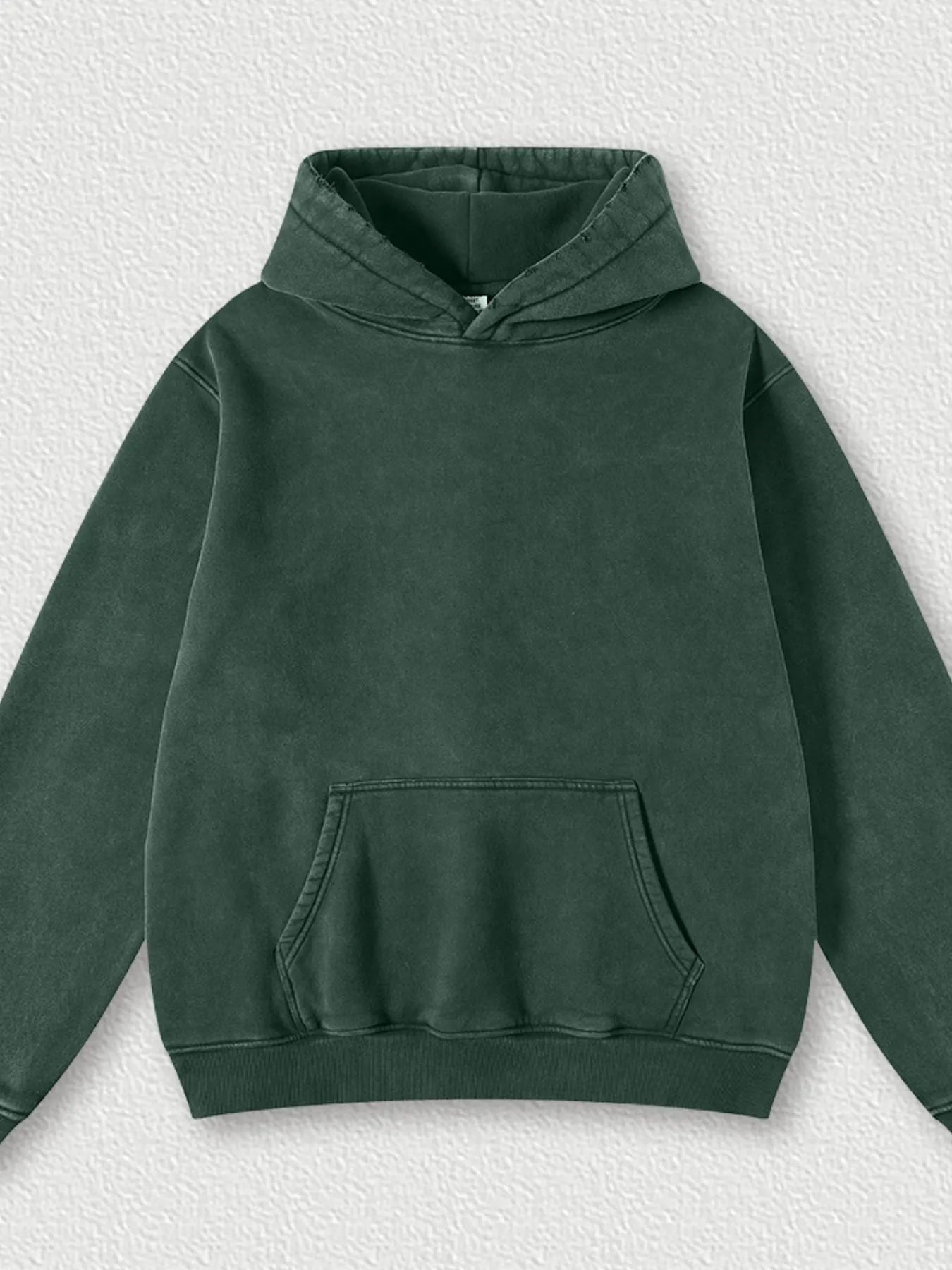 Model wearing Men's Kangaroo Pocket Dropped Shoulder Hoodie in D.green from the front.