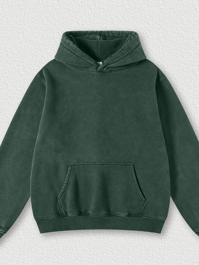 Model wearing Men's Kangaroo Pocket Dropped Shoulder Hoodie in D.green from the front.