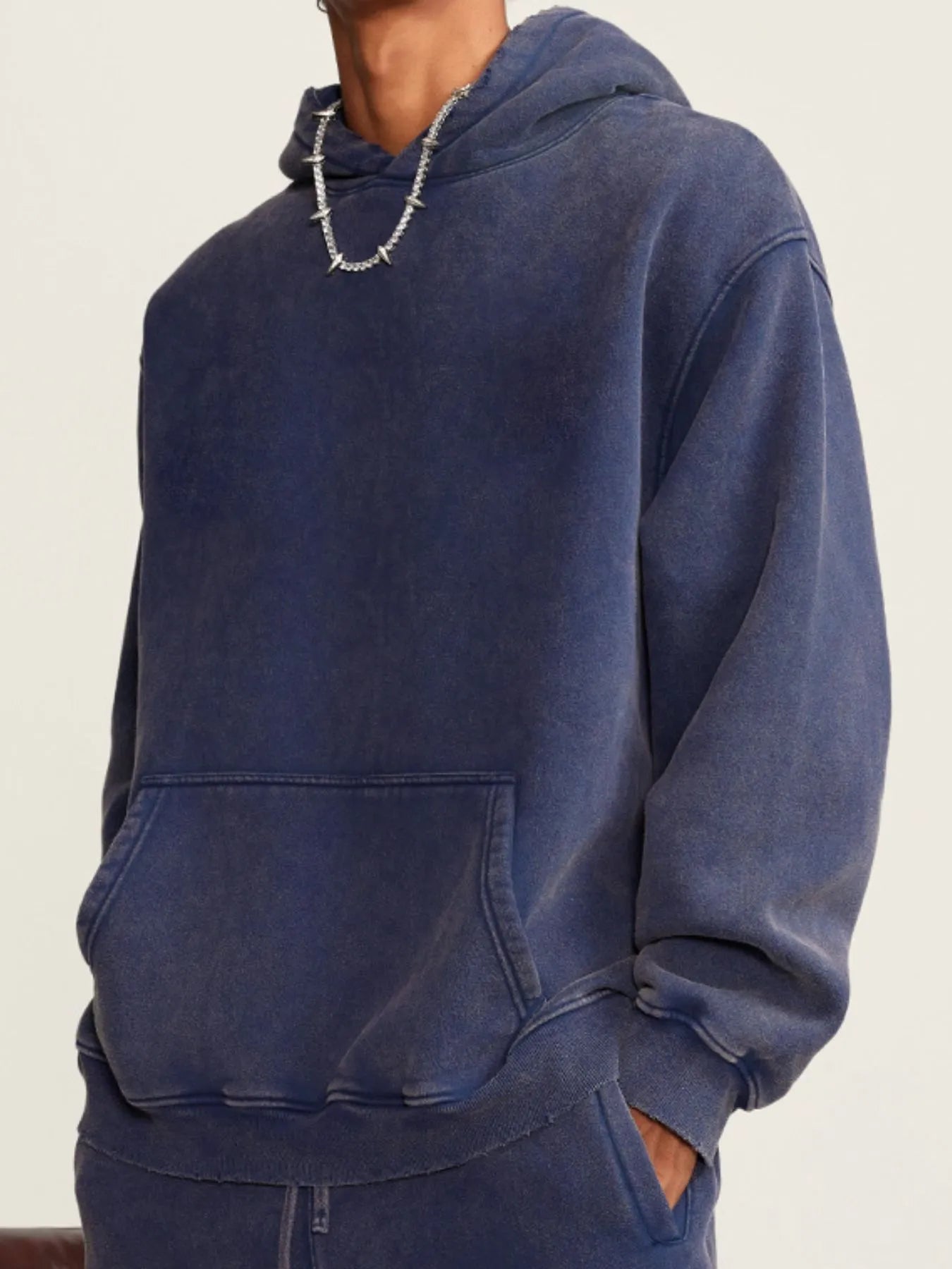 Side view showcasing the fit of Men's Kangaroo Pocket Dropped Shoulder Hoodie in Sapphire Blue.