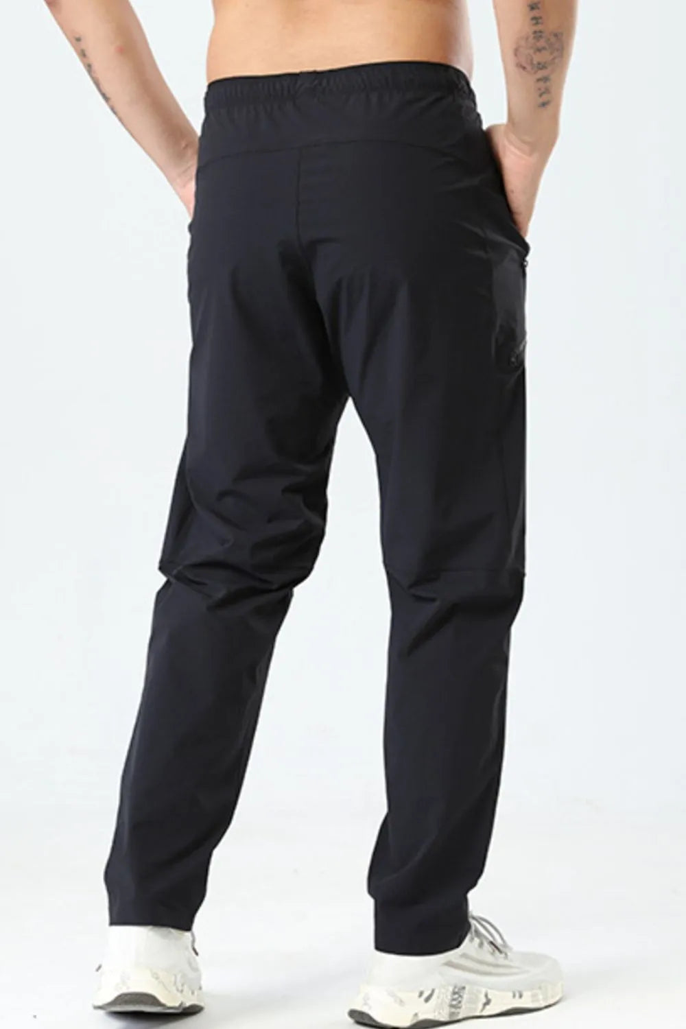 Side view showcasing the fit of Men's Plus Size Elastic Waist Loose Fit Pants in Black.