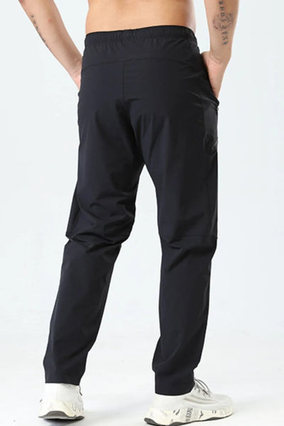 Side view showcasing the fit of Men's Plus Size Elastic Waist Loose Fit Pants in Black.