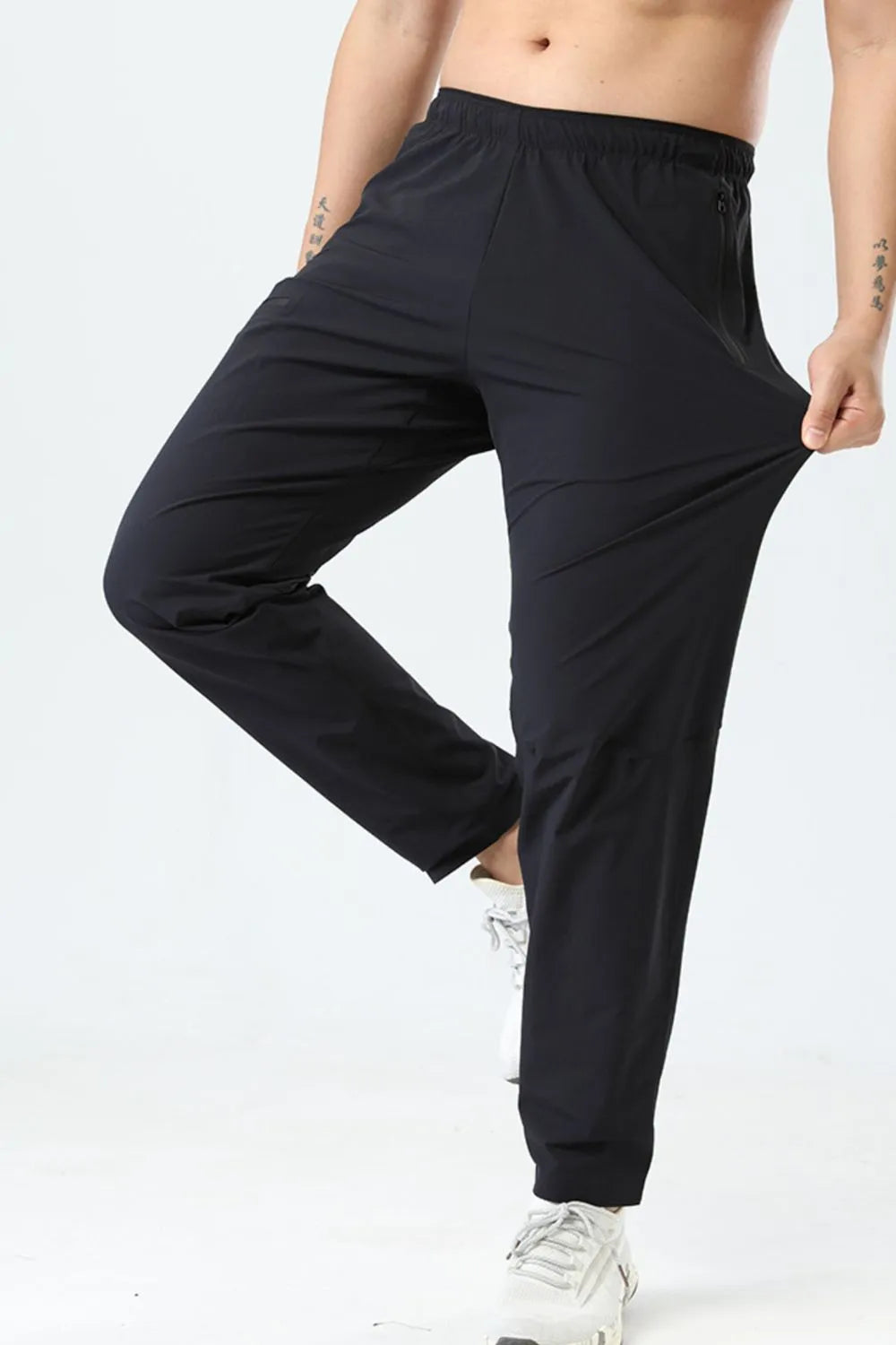 Back view highlighting the design of Men's Plus Size Elastic Waist Loose Fit Pants in Black.
