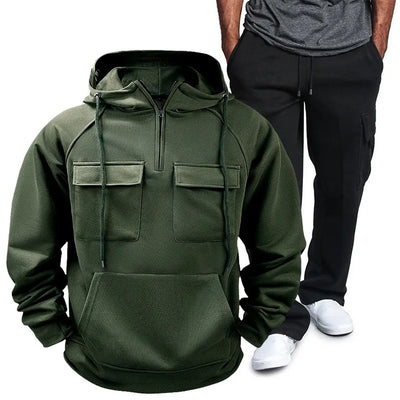 Model wearing Men's Pocketed Drawstring Hoodie and Pants Set in Army Green from the side