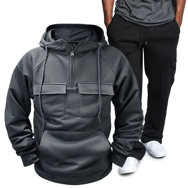 Side view showcasing the fit of Men's Pocketed Drawstring Hoodie and Pants Set in Dark Gray.