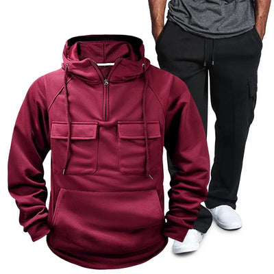 Model wearing Men's Pocketed Drawstring Hoodie and Pants Set in Deep Red from the back.
