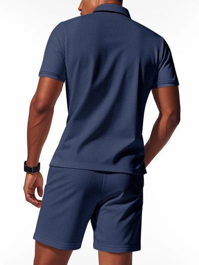Side view showcasing the fit of Men's Quarter Zip Short Sleeve Top and Shorts Set in Navy Blue.