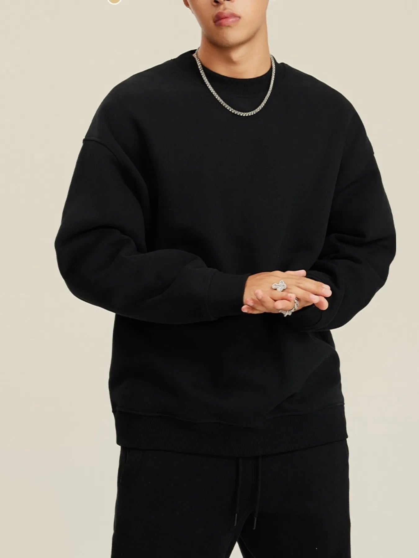 Front view of Men's Round Neck Dropped Shoulder Sweatshirt in Black.