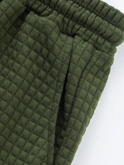 Close-up of the drawstring detail on Men's Textured Round Neck Top and Shorts Set in Army Green.