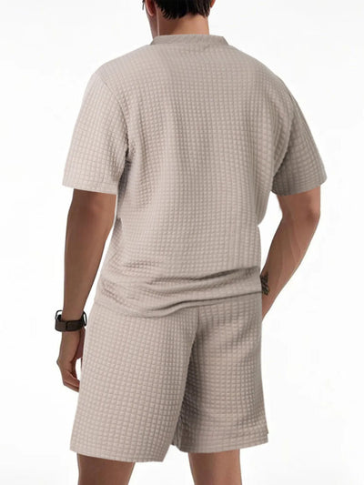 Side view showcasing the fit of Men's Textured Round Neck Top and Shorts Set in Khaki.