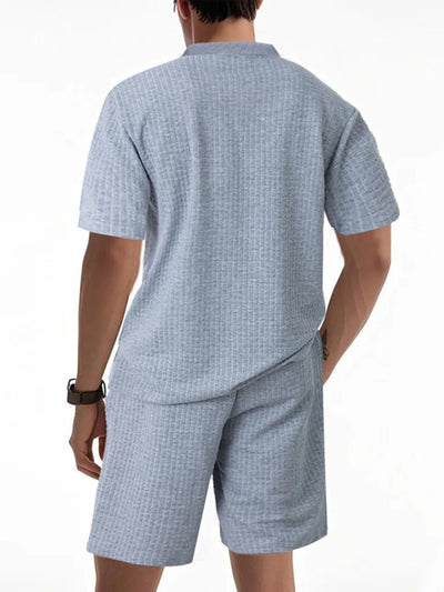 Side view showcasing the fit of Men's Textured Round Neck Top and Shorts Set in Light Gray.