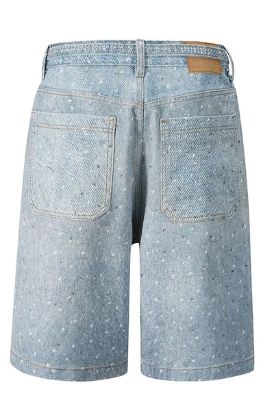Side view showcasing the fit of Men's Washed Rhinestone Denim Bermuda Shorts in Medium wash.