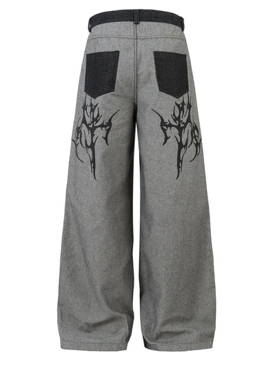 Side view showcasing the fit of Men's Wide Leg Jeans in Grey with tribal design.