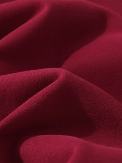 Flat lay of Men's Zip-Up Hooded Jacket in Red with graphic design.