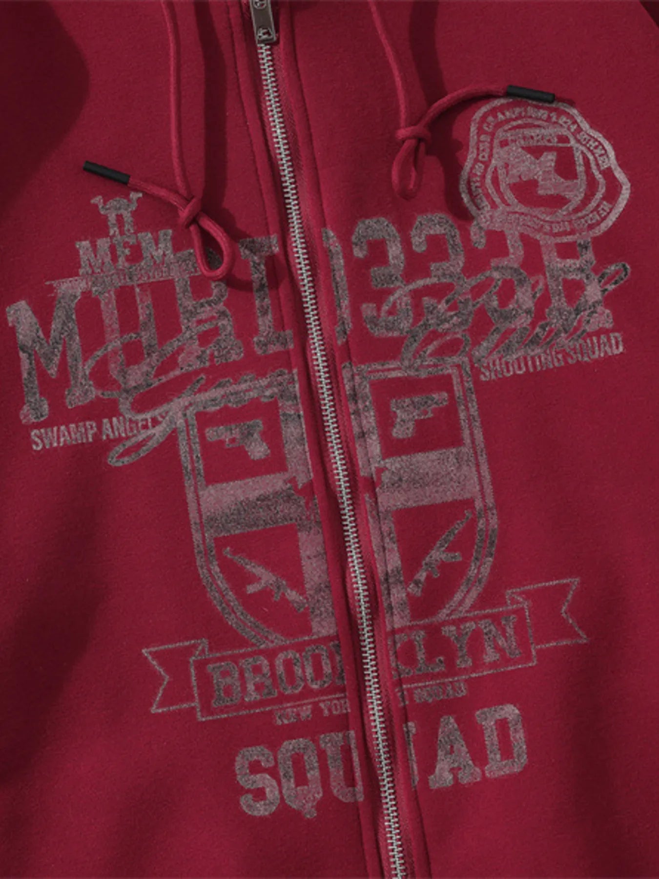 Model wearing Men's Zip-Up Hooded Jacket in Red.