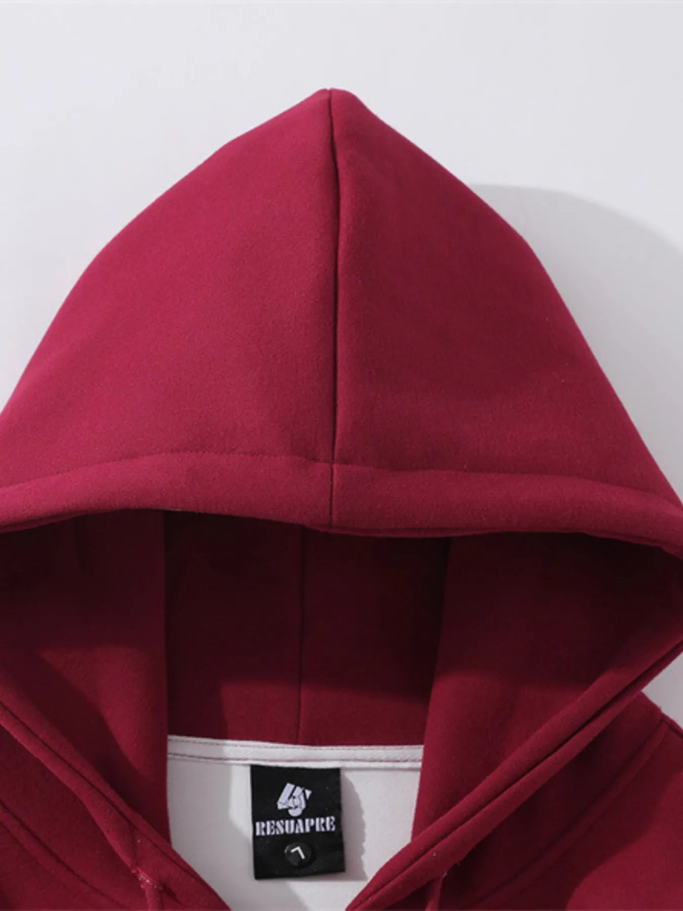 Back view highlighting the design of Men's Zip-Up Hooded Jacket in Red with graphic design.