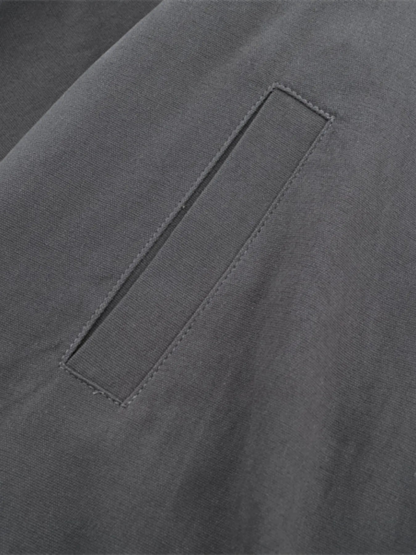 Model wearing Men's Zip-Up Long Sleeve Jacket in Dark Gray.