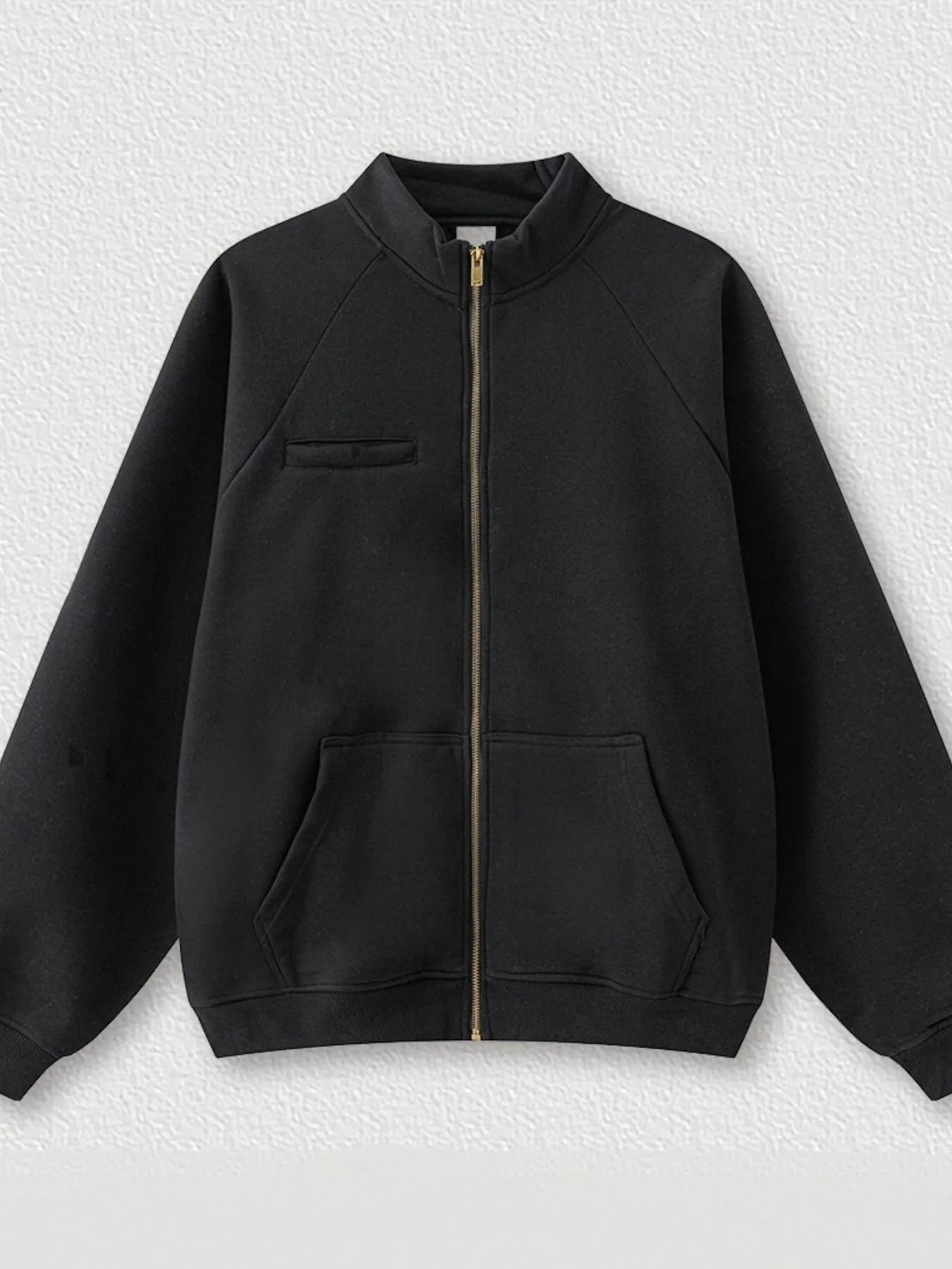 Model wearing Men's Zip-Up Raglan Sleeve Sweatshirt in Black.