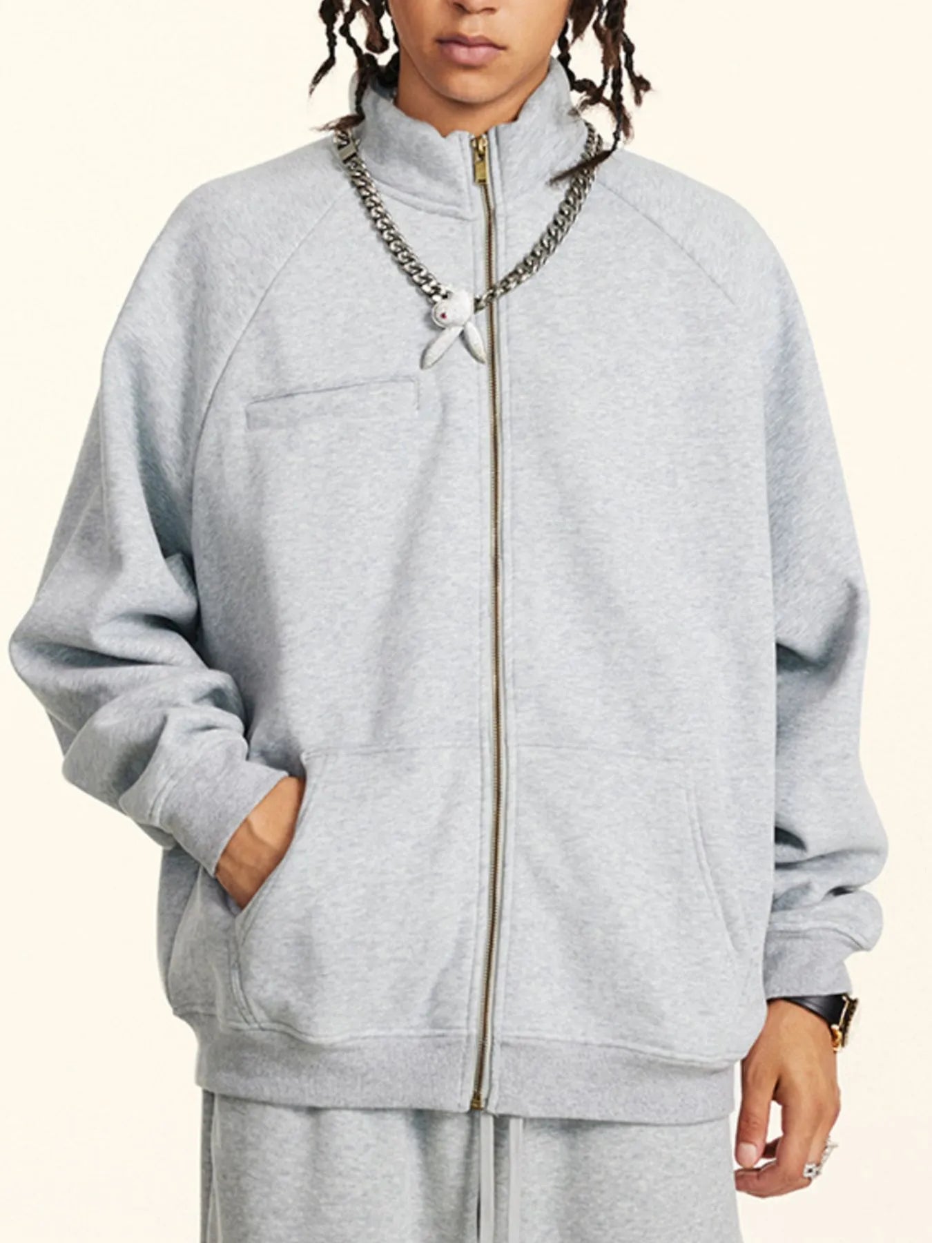 Model wearing Men's Zip-Up Raglan Sleeve Sweatshirt in Gray.