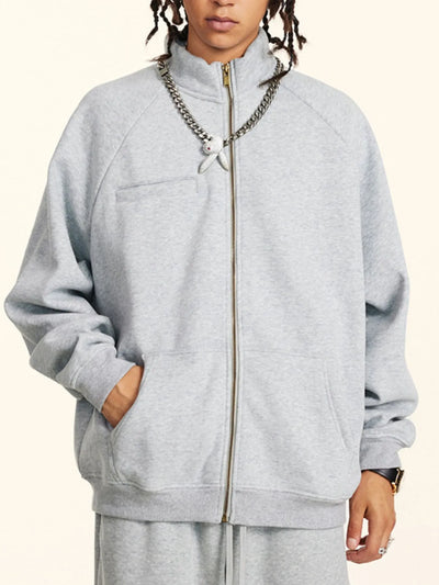 Model wearing Men's Zip-Up Raglan Sleeve Sweatshirt in Gray.